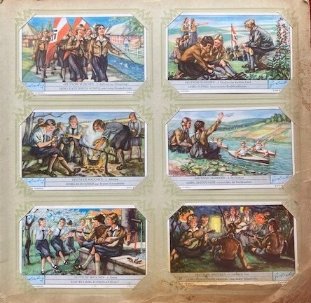 A page of a postcard album with six postcards. The postcards all depict life at a summer camp for Hitler Youth children. In one, girls march with a swastika flag; in another, they are gathered around chatting; in a third, they sit around a campfire with a pot hanging over it on sticks. In a fourth, they wave to boys on a lake who are in kayaks; in a fifth, girls sit on a stage with guitars, while two girls dance nearby; in the final postcard, girls and boys sit around a campfire with instruments.